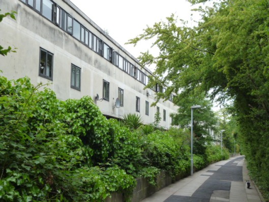 Ainsworth Way: the rear of the four-storey block skirting the park