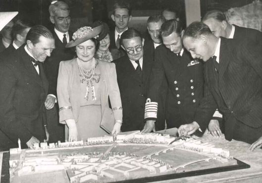 King George VI and Queen Elizabeth with Sir Patrick Abercrombie and J. H. Forshaw at an exhibition for the London Plan