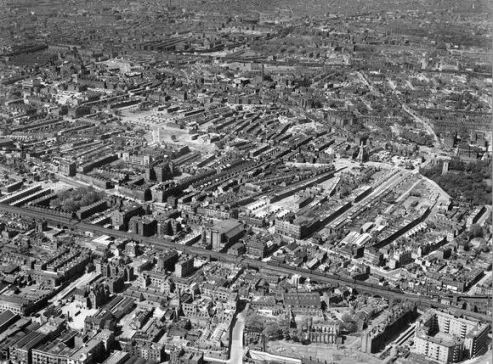 An aerial view of Shadwell and Stepney from the south-east in 1946.  John Scurr House can be seen in the bottom right-hand corner. EAW000637 Britain from Above © English Heritage